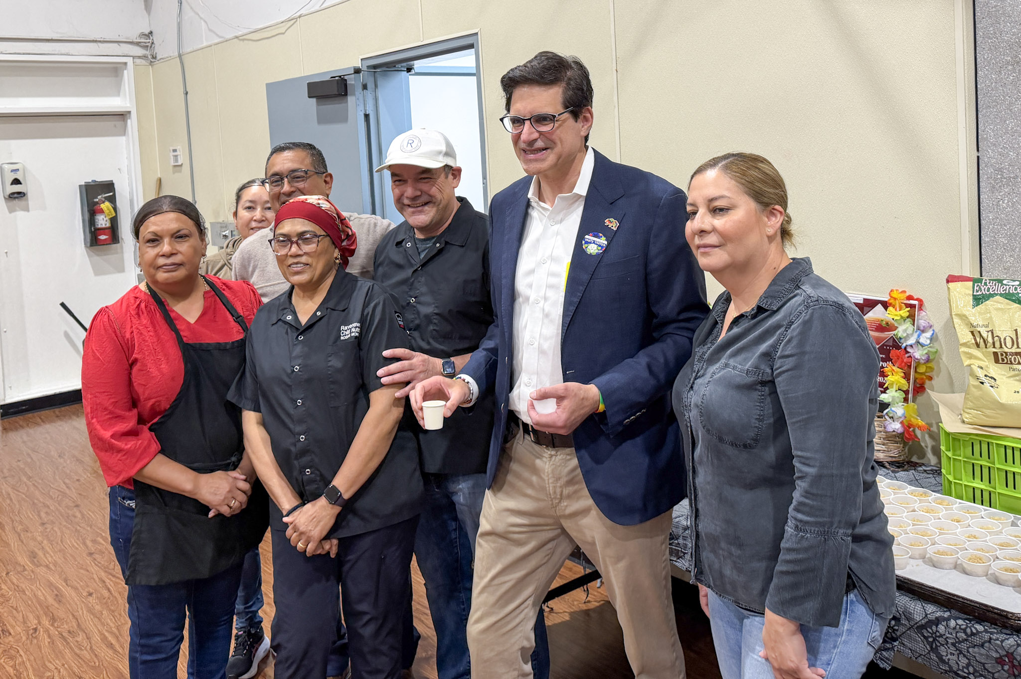 Ravenswood School District does a taste test with Summer School Studentsl Front L to R: Irma Munoz, Roshni Mohammed, Fidel Alas, Senator Josh Becker (holding a bone broth sample cup), Maria Vazquez. Back: Norma Becerra, Juan Vizcardo. Photo: Kathy Webster