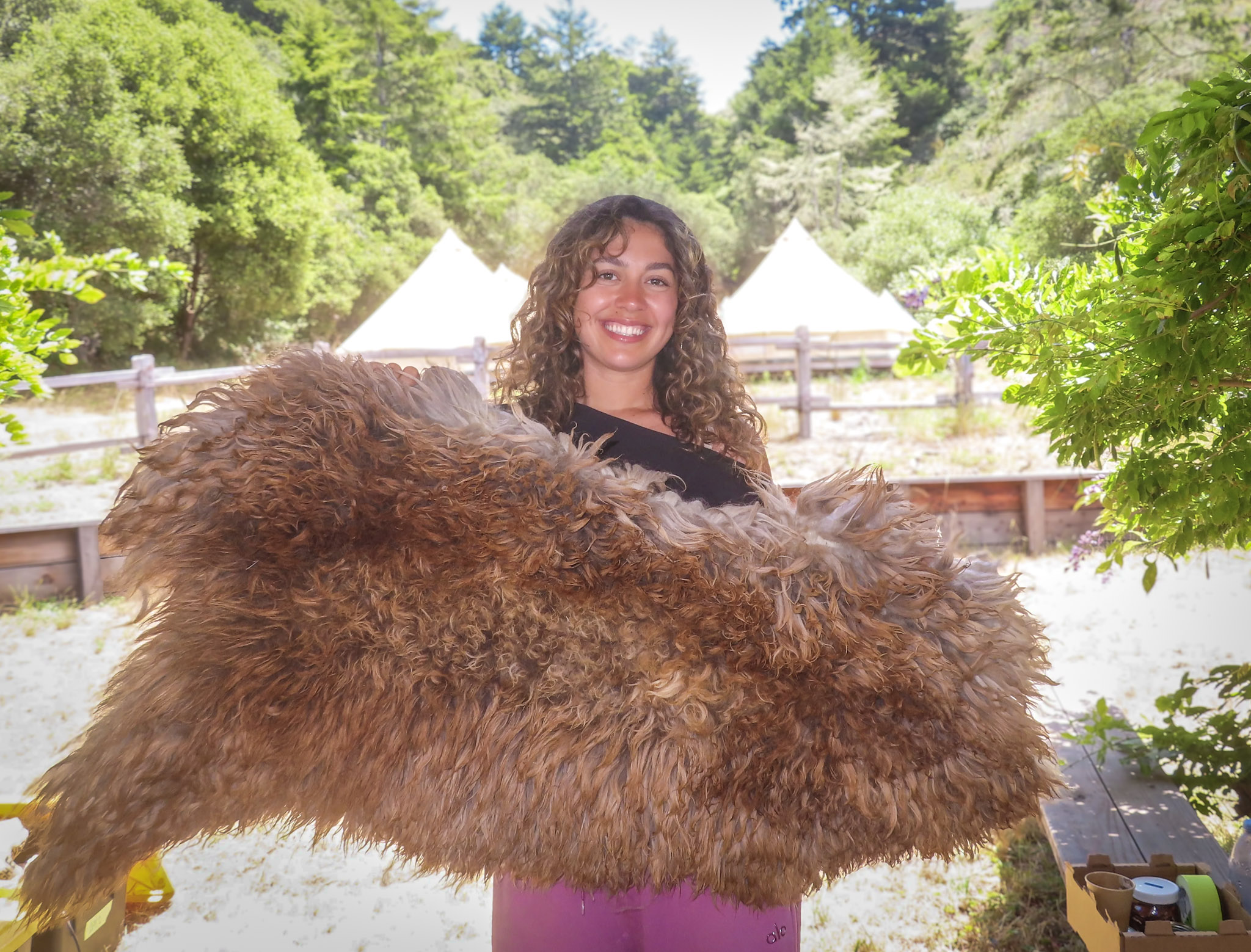 Abby Garewal proudly displays a goat hide she tanned herself during a tanning workshop at TomKat Ranch.